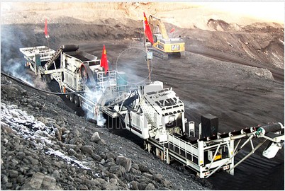 Mobile rock crusher in open pit mine