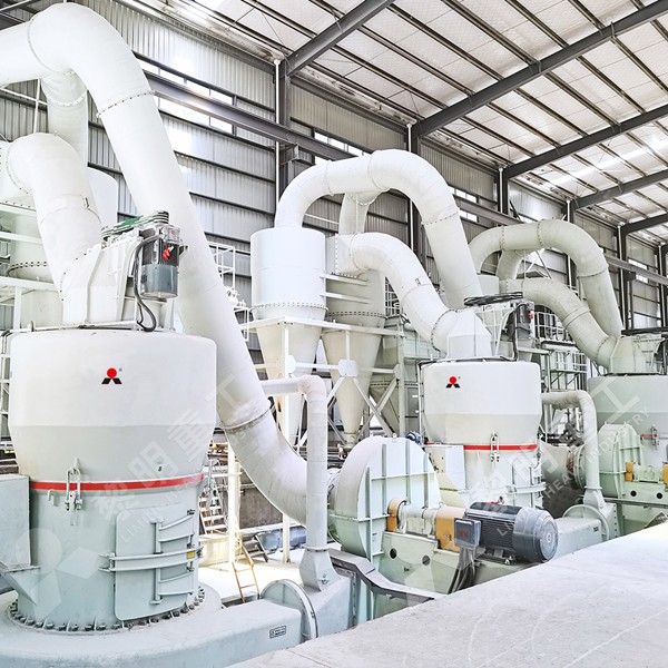 Modern control room with operator monitoring grinding mill parameters on SCADA system